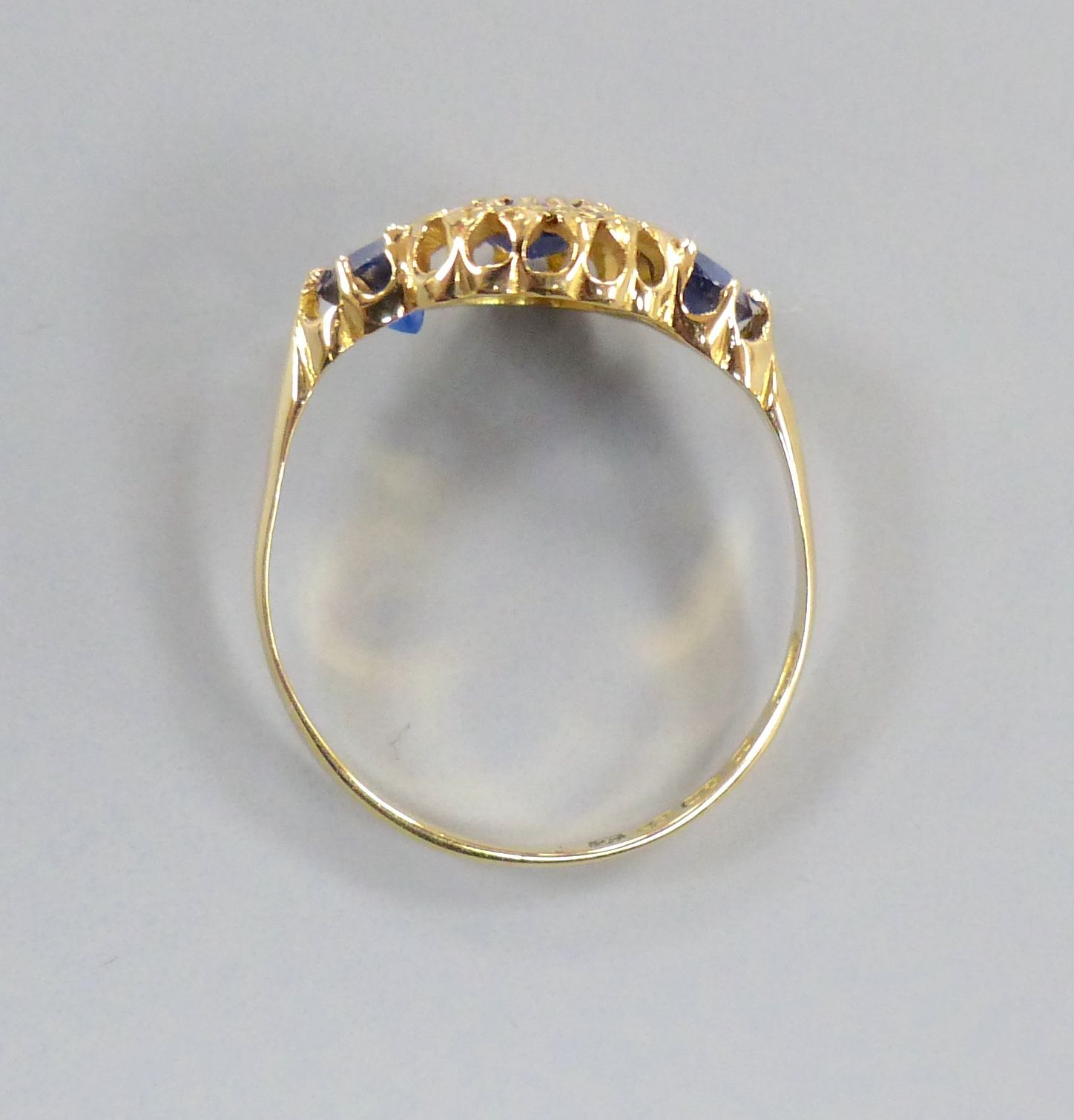 A George V 18ct gold, sapphire and diamond chip cluster dress ring, size R/S, gross 2.7 grams.